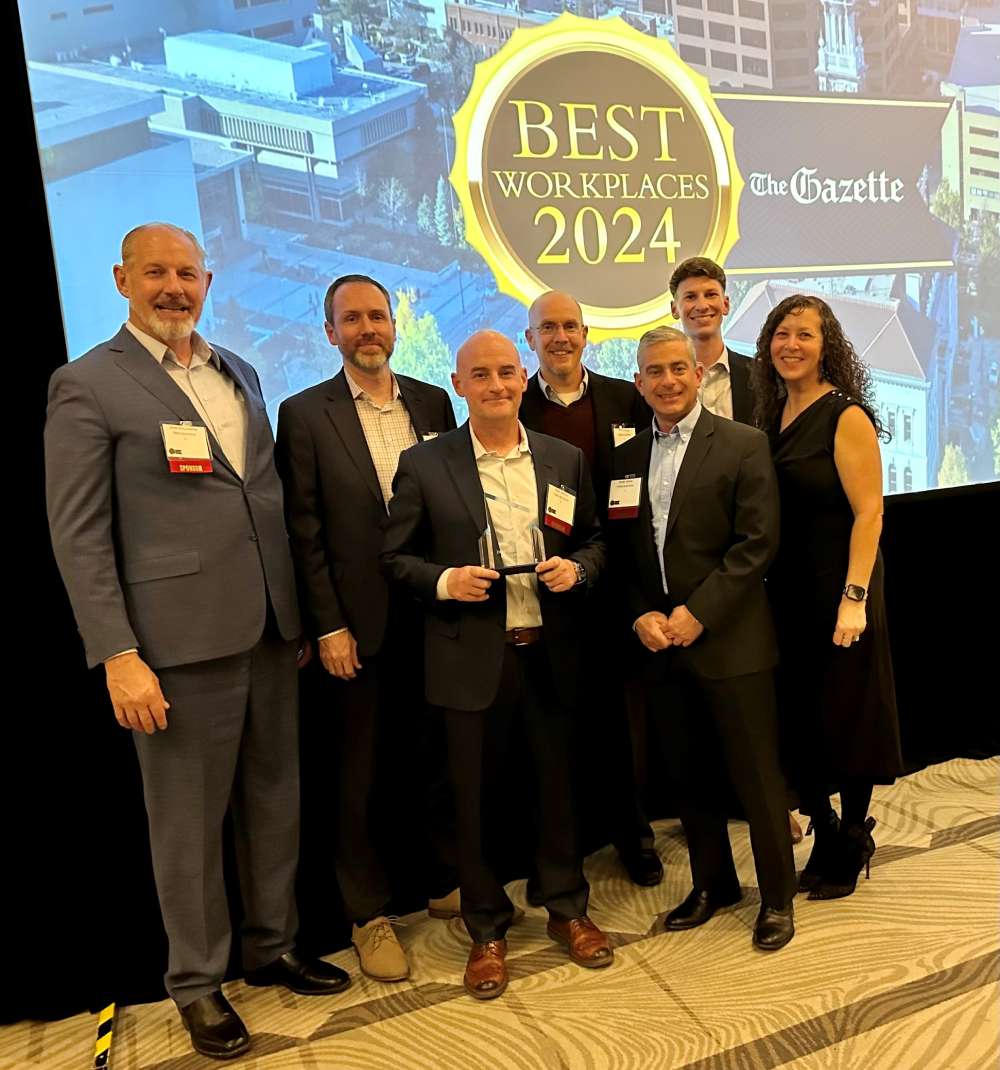 Delta Solutions & Strategies team receiving industry award recognition.