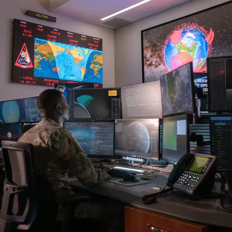 Mission operations specialist monitoring command center systems.